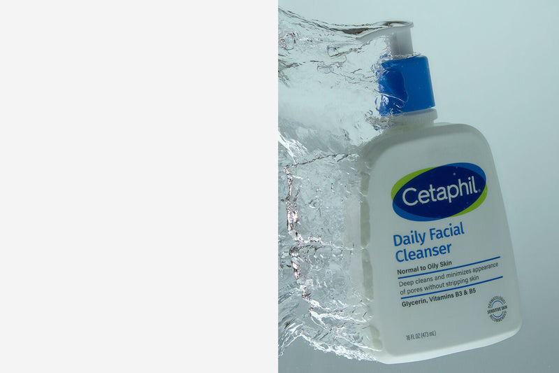 Person applying facial cleanser with product visible